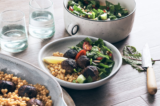 Teaser image for One-pan venison meatballs with Israeli couscous and salad