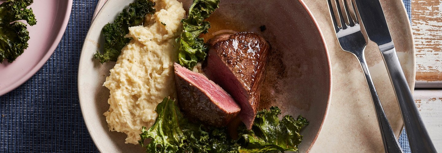 Hero image for Venison Steaks with parsley & garlic butter, celeriac and kale crisps