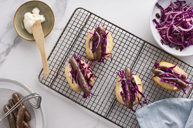 Teaser image for First Light venison chipolatas with red cabbage slaw